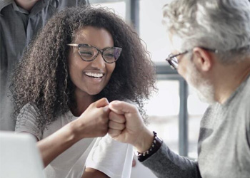 Working Woman high-fiving a co-worker